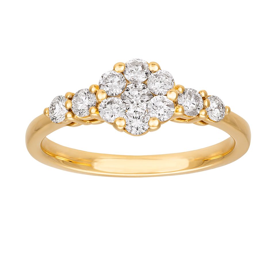 Diamantring i 18K guld med sido stenar från Guldfynd